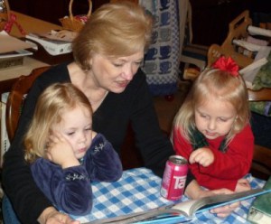 Mom reading to two granddaughters (Photo by C. M. Dennis, 12/2008)
